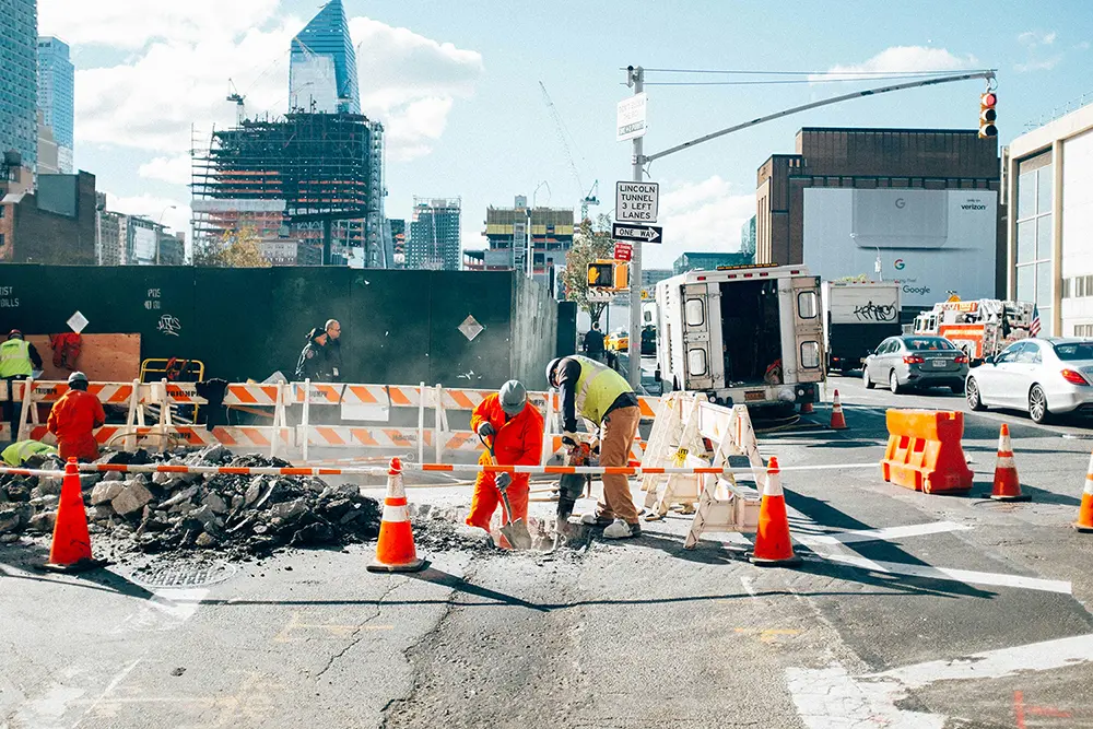 Construction site workers collaborating on project